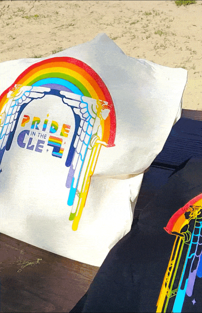 Gif showing tote bag and t-shirt with Pride in the CLE designs shot at Edgewater Beach