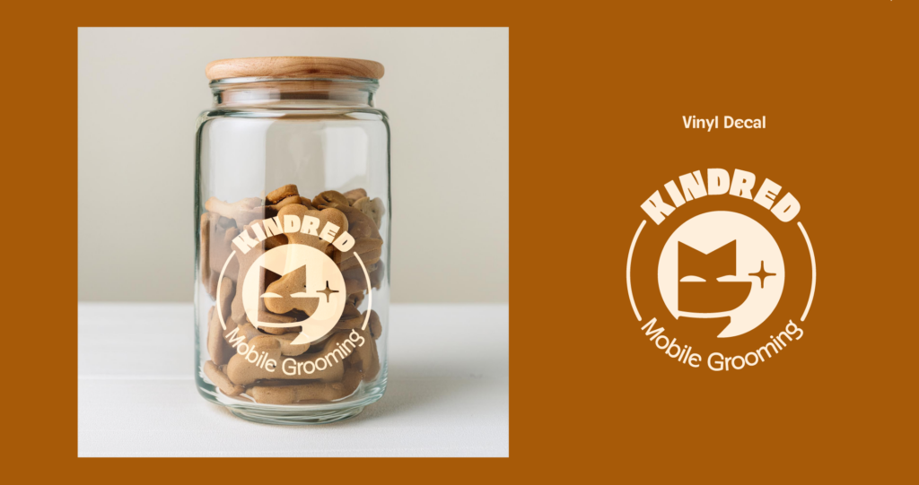 Kindred Mobile Grooming, treat jar design, mock-up on the left, decal design on the right on an orange background. Badge style logo with "Kindred" in a circle at the top and "mobile grooming" at the bottom. Logomark in the center.