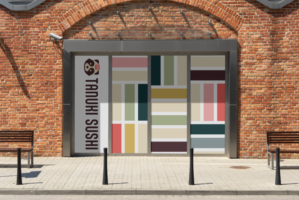 Tanuki Sushi sign mock-up on windows of doors to a brick building